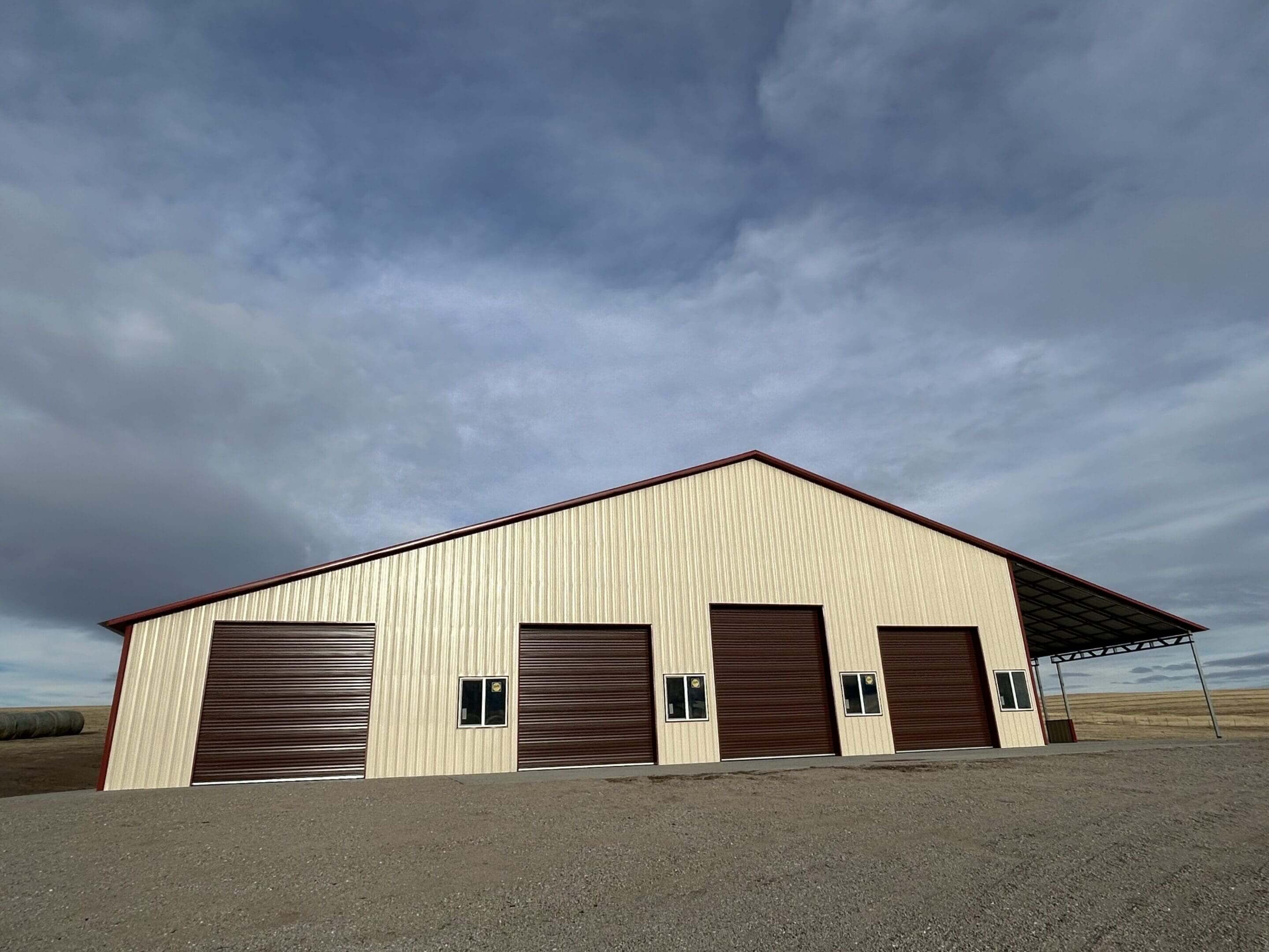 Metal warehouse with multiple garage doors.