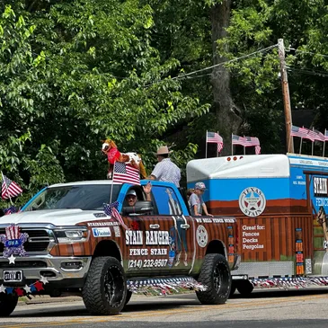 Truck and trailer in a patriotic parade.